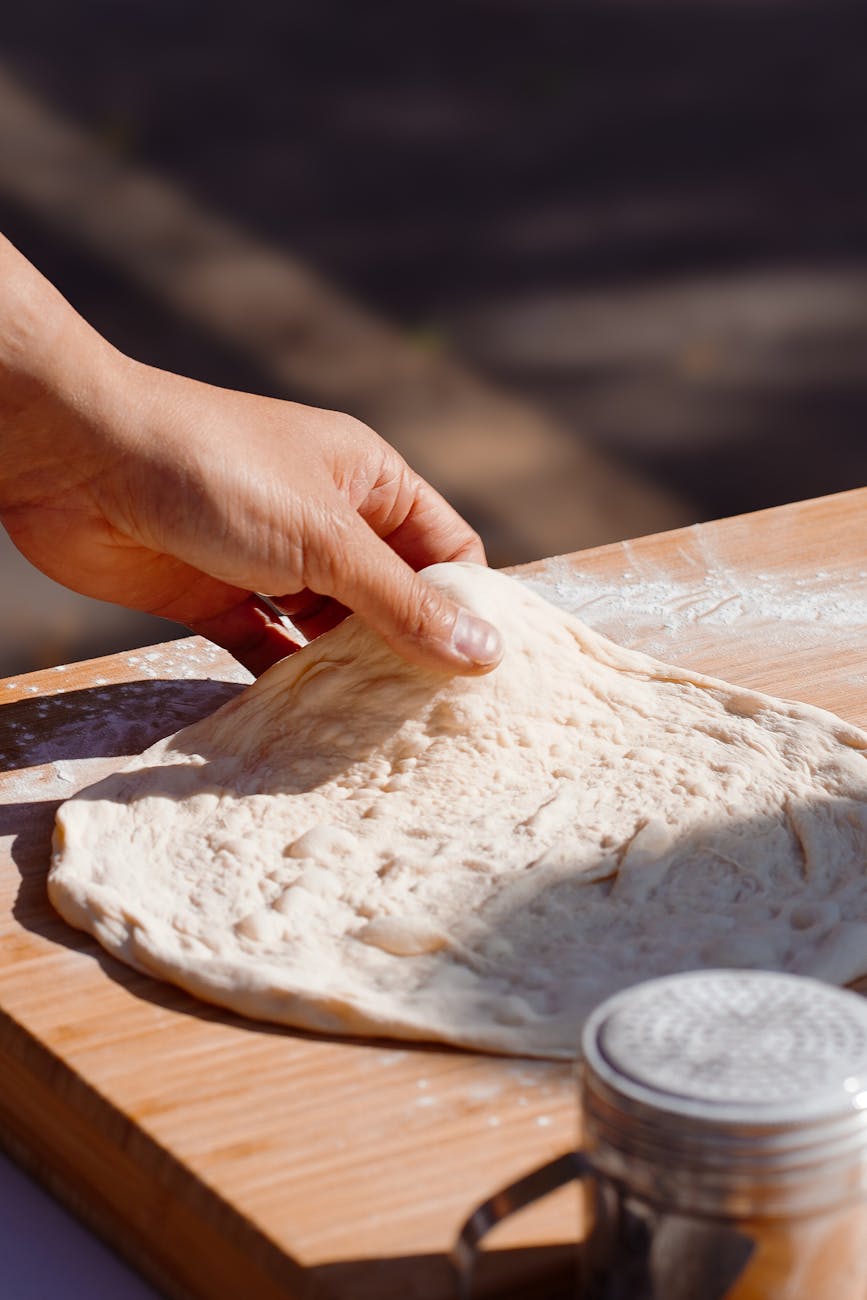 artisan pizza dough preparation in natural light